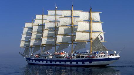Majestic Sailing Ship Drifting on Calm Waters wallpaper