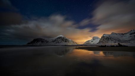 Serene Winter Night Over Snowy Mountains and Reflective Waters wallpaper