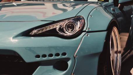 Sleek Blue Sports Car Detail Wallpaper wallpaper