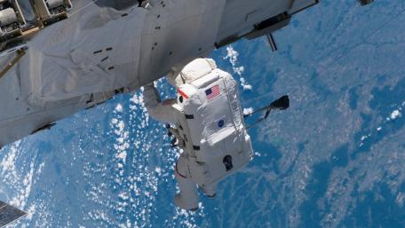 Astronaut in Space Capturing the Universe's Beauty wallpaper
