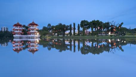 Serene Reflection of City Landmarks at Dusk wallpaper