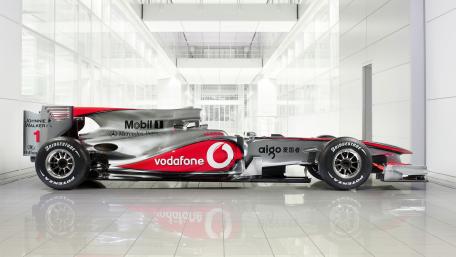 Sleek Race Car in Modern Setting wallpaper