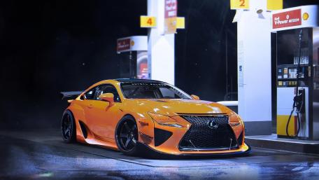 Vibrant Lexus Sports Car at Nighttime Gas Station wallpaper