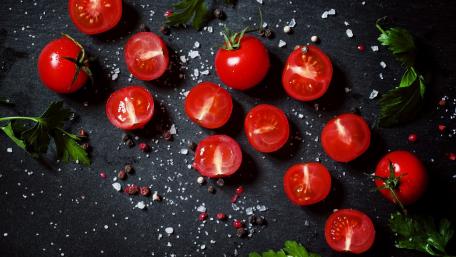 Fresh Tomatoes on a Dark Surface for a Culinary Delight wallpaper
