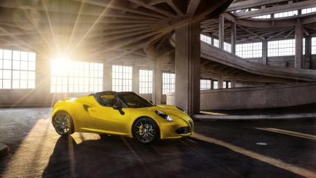 Sleek Yellow Sports Car in Modern Architecture wallpaper