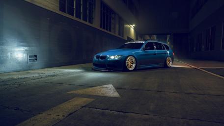 Sleek Blue BMW in Urban Setting wallpaper