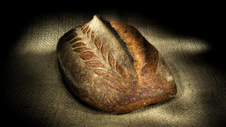 Artisanal Bread Highlighting Rustic Charm and Texture wallpaper