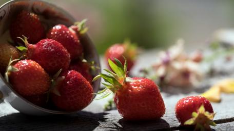 Fresh Strawberries in a Rustic Setting wallpaper