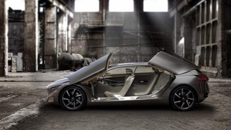 Sleek Modern Car in Industrial Setting wallpaper