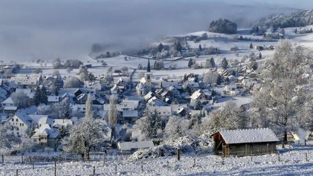 Winter Wonderland Serenity in a Snowy Village wallpaper