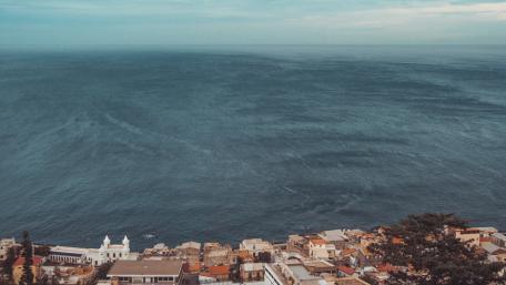 Ocean View Over Cityscape Wallpaper wallpaper