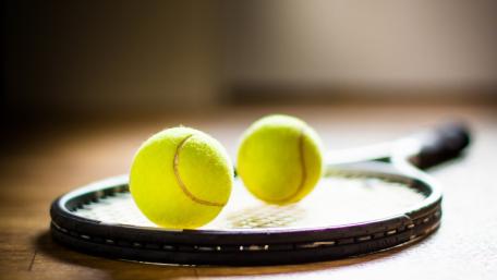 Tennis Balls and Racket Ready for Action wallpaper