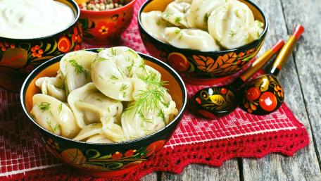 Delicious Dumplings in Traditional Bowls wallpaper