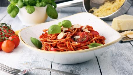 Delicious Spaghetti with Fresh Basil and Cherry Tomatoes wallpaper