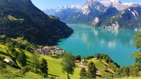 Serene Lakeside View Amid Majestic Mountains wallpaper