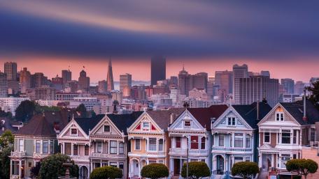 Charming Cityscape at Dusk with Historic Houses wallpaper