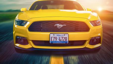 Vibrant Yellow Muscle Car on the Road wallpaper