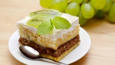 Delicious Layered Cake with Fresh Fruits and Mint Decoration wallpaper