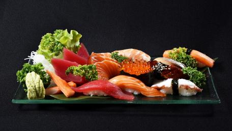 Savor the Delights of Fresh Sushi Artistry wallpaper