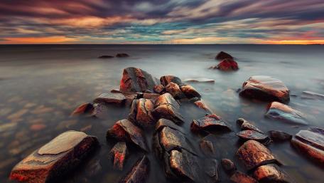 Dramatic Seascape with Colorful Skies and Rocks wallpaper