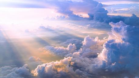 Heavenly Skies Illuminated by Golden Light wallpaper