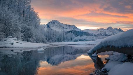 Serene Winter Landscape Reflected in Tranquil Waters wallpaper