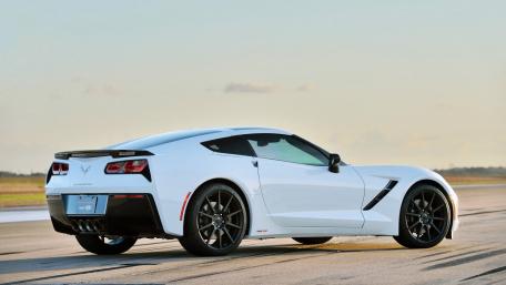 Sleek White Sports Car Under a Golden Sky wallpaper