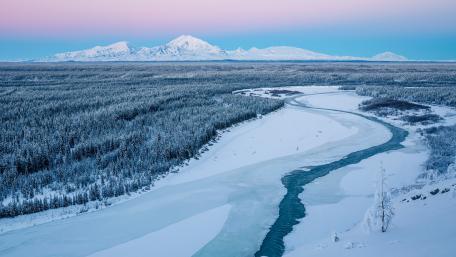 Serene Winter Landscape with Majestic Mountains wallpaper