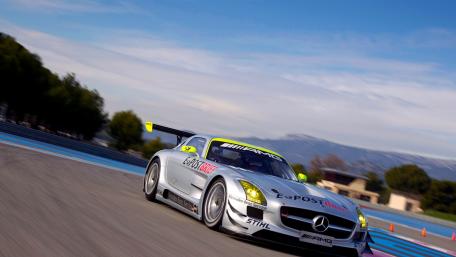 Sleek Silver Racing Machine in Action wallpaper
