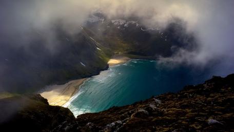 Majestic Coastal View Under Cloudy Skies wallpaper