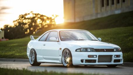 Sleek White Sports Car at Sunset wallpaper