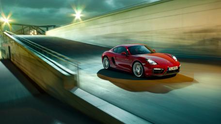 Sleek Red Sports Car in Motion wallpaper