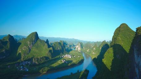 Serene Mountain Landscape Overlooking a River Flowing Through Valleys wallpaper