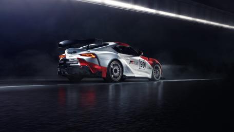 Sleek Racing Car in Dynamic Setting wallpaper