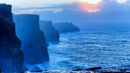 Majestic Cliffs at Dawn’s Embrace wallpaper