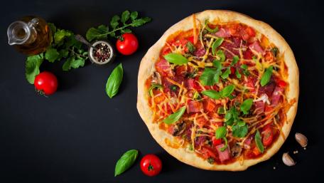 Deliciously Fresh Pizza with Toppings wallpaper