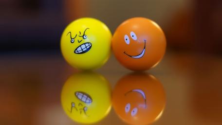 Cheerful Balls in a Playful Duel wallpaper
