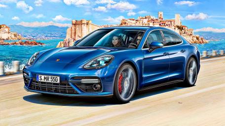 Sleek Blue Porsche on Coastal Road wallpaper