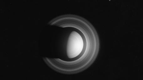 Celestial Dance of Rings and Shadows wallpaper
