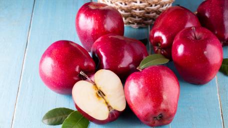 Fresh Red Apples on Wooden Table wallpaper