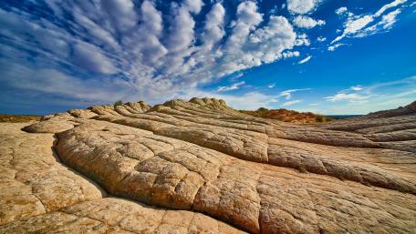 Stunning Rocky Landscape Under Dramatic Skies wallpaper