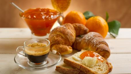 Delicious Breakfast Spread with Coffee and Croissants wallpaper