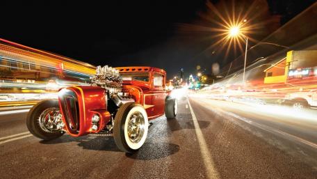 Classic Hot Rod at Night with Blurred Lights wallpaper