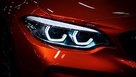 Vibrant Orange Car Headlight Glow wallpaper