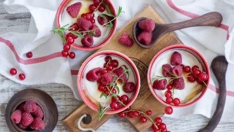 Delightful Berry Dessert Bowls Decorated with Fresh Ingredients wallpaper