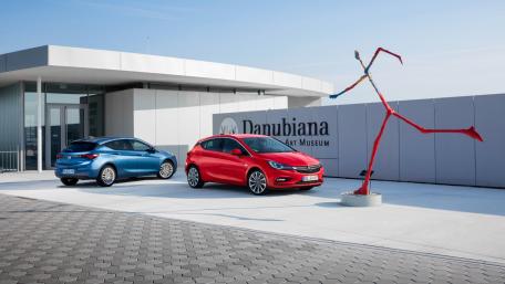 Sleek Cars at Danubiana Art Museum Showcase wallpaper