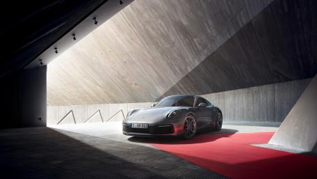 Sleek Sports Car Under Dramatic Lighting wallpaper