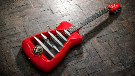Vibrant Red Guitar Wallpaper for Music Lovers wallpaper