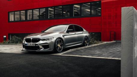 Sleek BMW Beauty in Modern Setting wallpaper