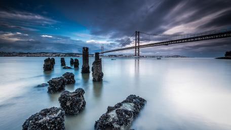 Majestic Bridge Against a Dramatic Sky wallpaper